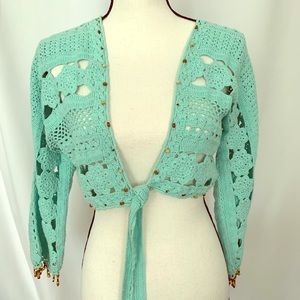 Cropped knit cardigan.